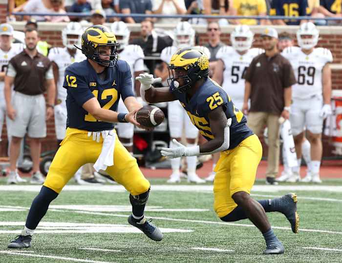 Cade McNamara and Hassan Haskins